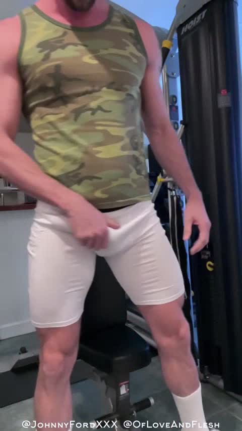 Hot Guy stretching his shorts and cock